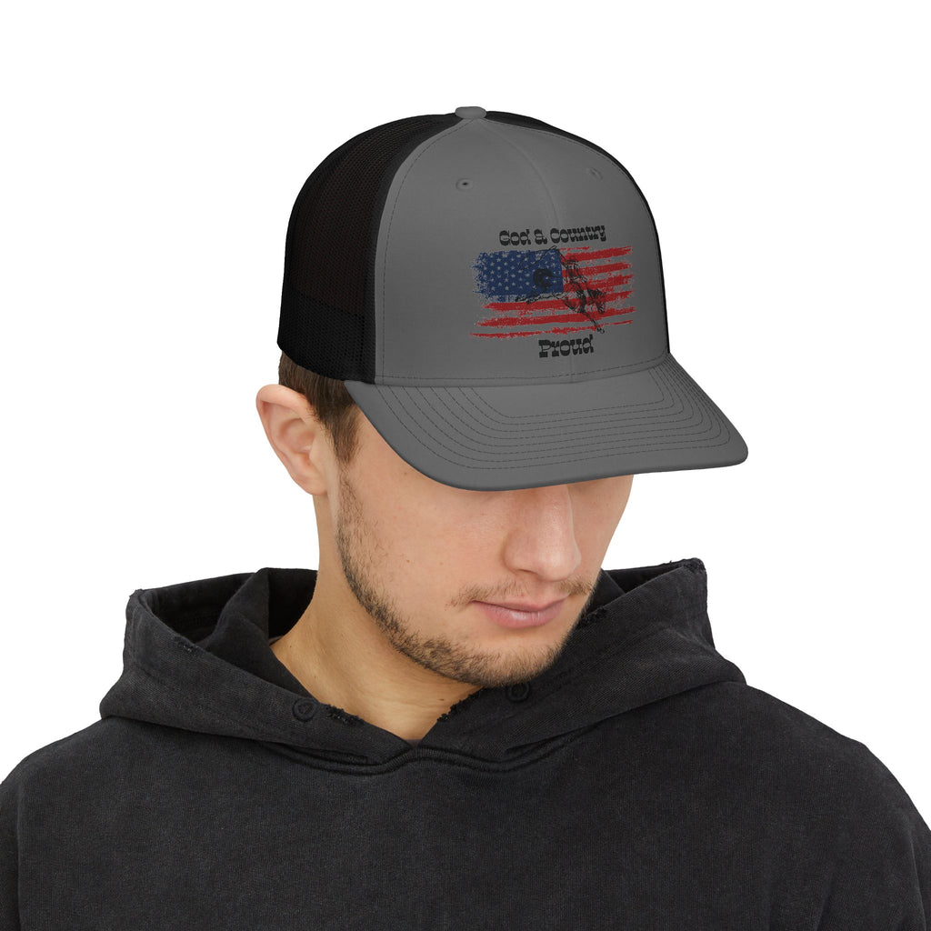 God & Country Trucker Cap in gray and black with American flag design, shown from the front