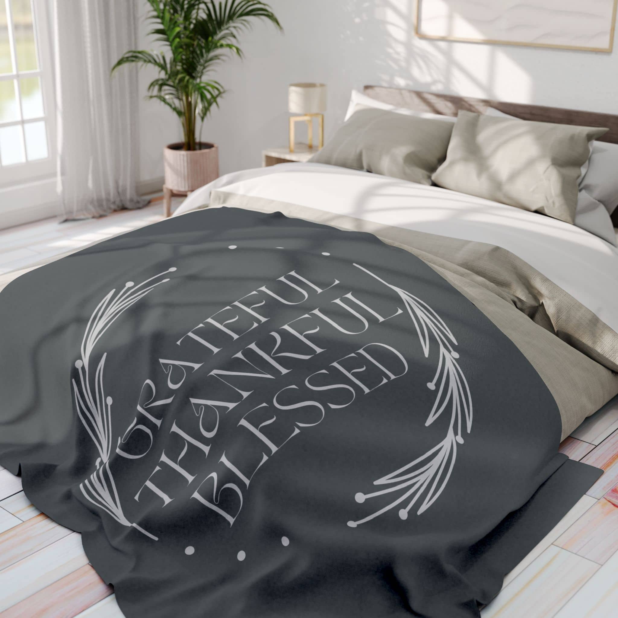 Cozy Grateful Thankful Blessed throw blanket on a bed with neutral bedding and soft textures