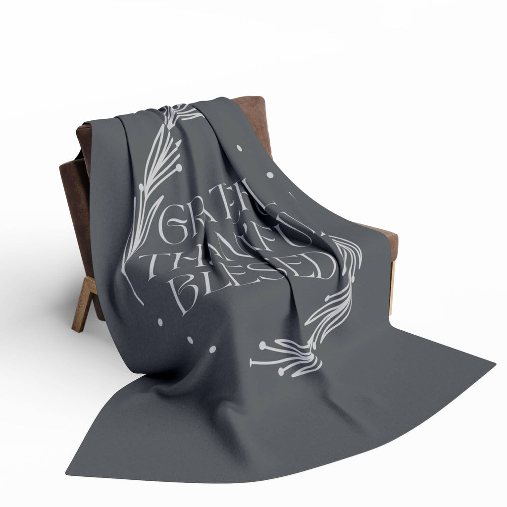 Cozy Grateful Thankful Blessed throw blanket displayed on a stylish chair for home decor