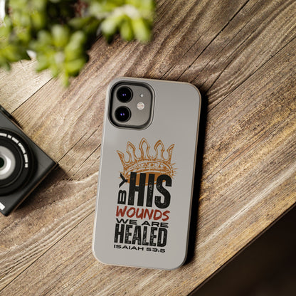 Logos gray scripture phone cover with Isaiah 53:5 design and protective fit on wooden surface