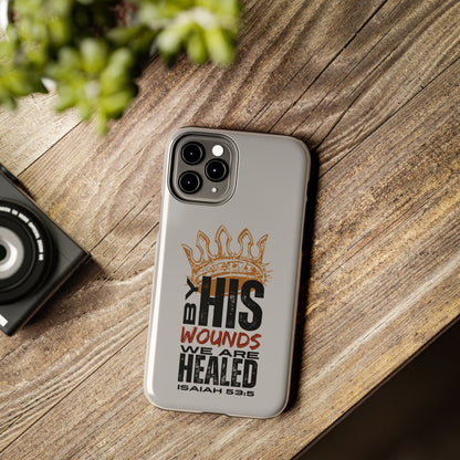 Logos gray scripture phone cover with Isaiah 53:5 quote and crown design on wooden surface