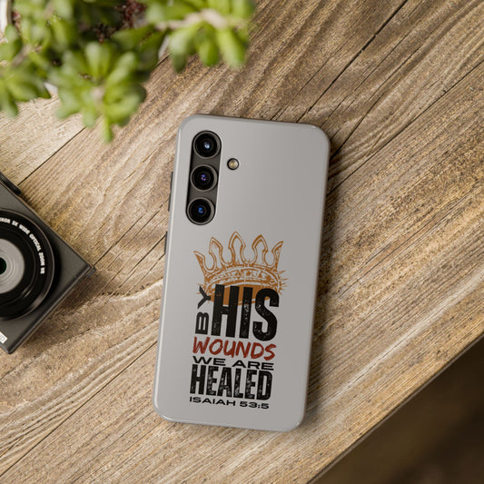 Logos gray scripture phone cover with Isaiah 53:5 healing design on wooden surface
