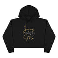 Black Jesus Loves Me crop hoodie featuring gold text and heart design for stylish comfort