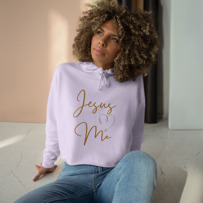 Woman wearing a lavender Jesus Loves Me crop hoodie with casual jeans