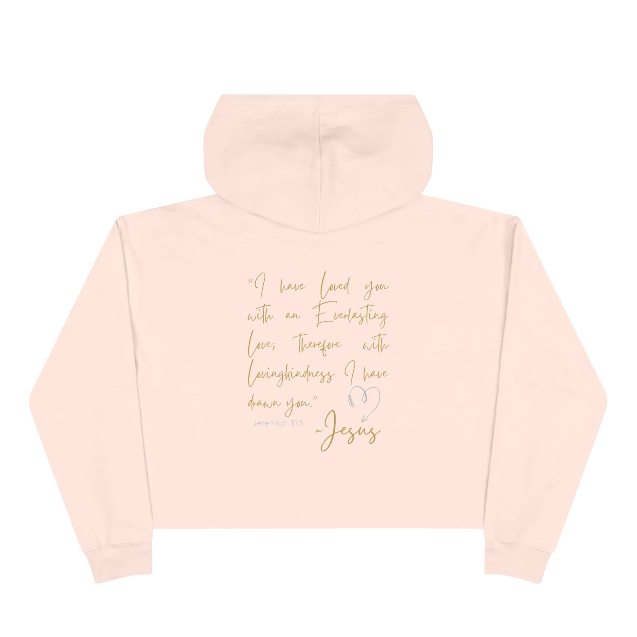 Jesus Loves Me crop hoodie in soft pink with inspirational text and a hood for comfortable wear