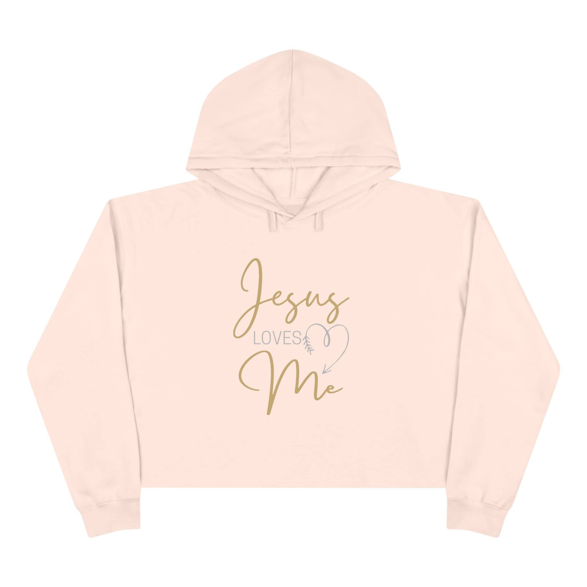 Jesus Loves Me crop hoodie in blush pink with stylish gold lettering for a trendy look