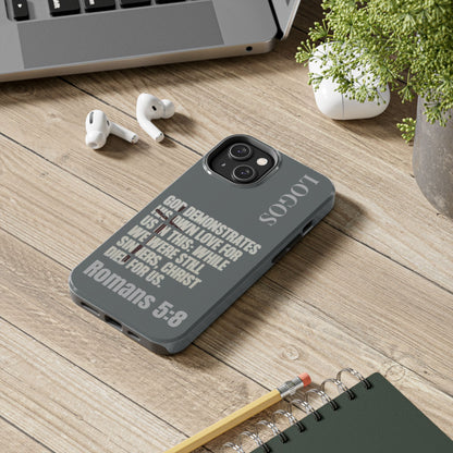 Logos Co. Gray Christian phone case with Bible verse Romans 5:8 on gray background for iPhone