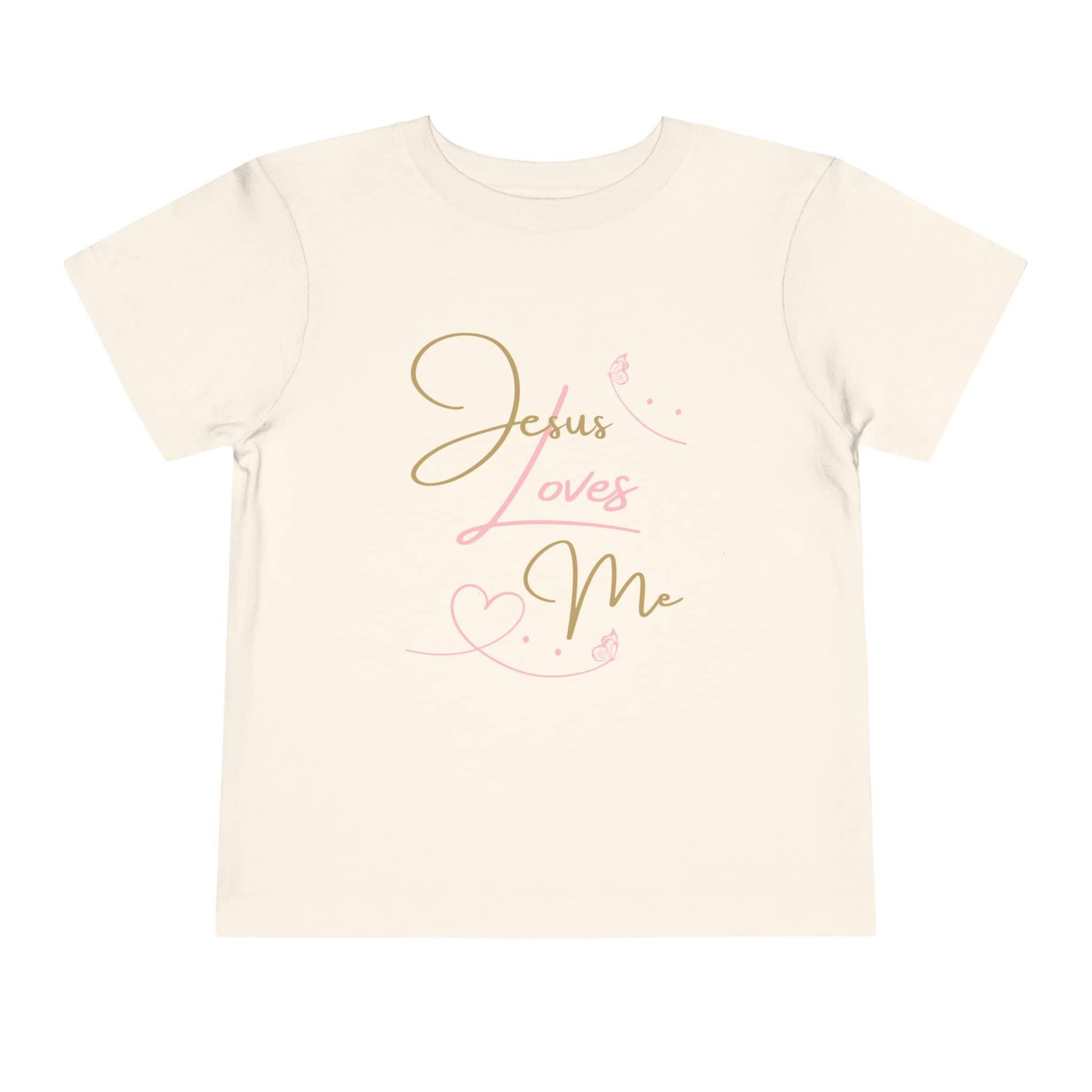 Logos Co. kids cream Jesus Loves Me shirt with elegant gold and pink script and heart design