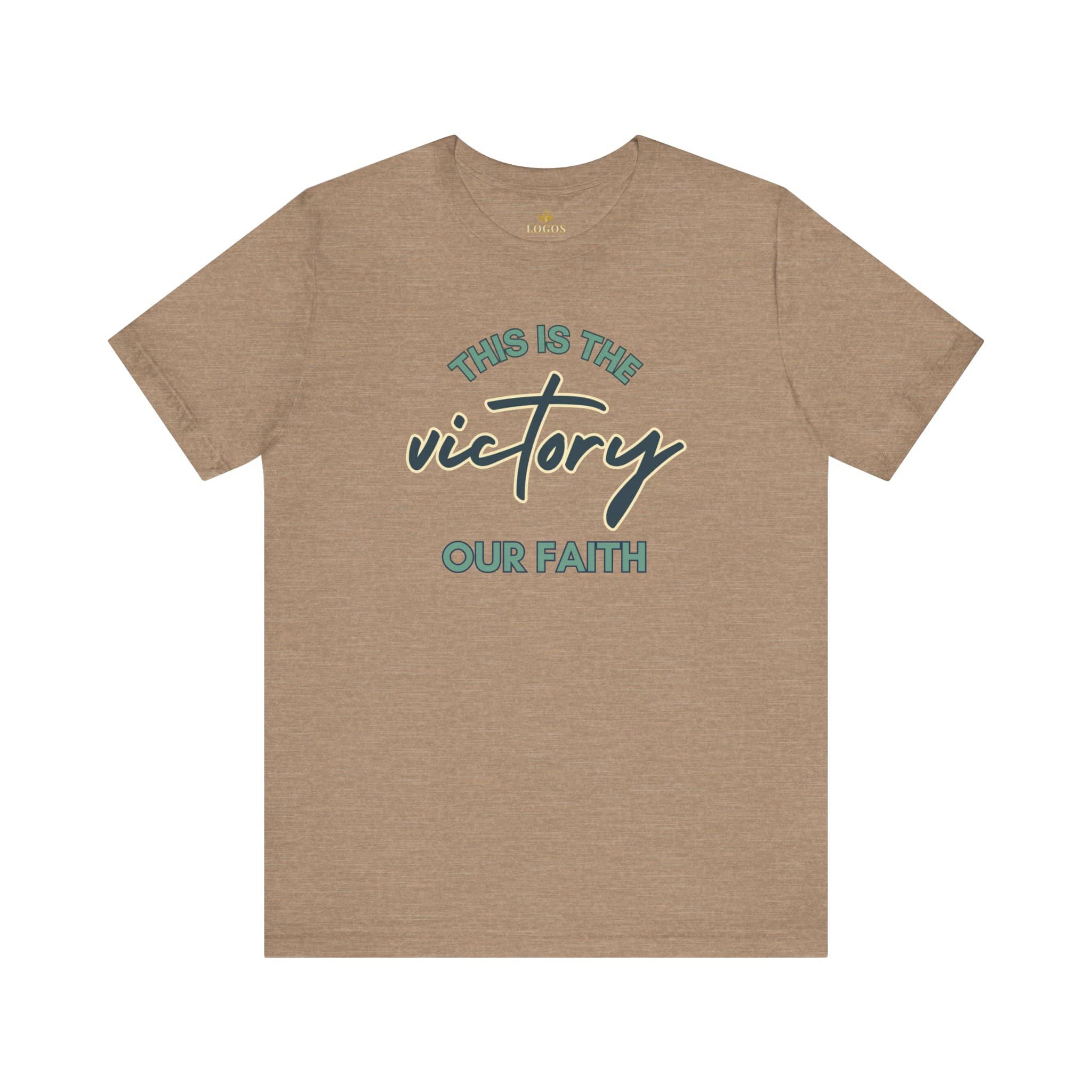 Logos tan T-shirt with This Is The Victory T-shirt text and cross design for faith