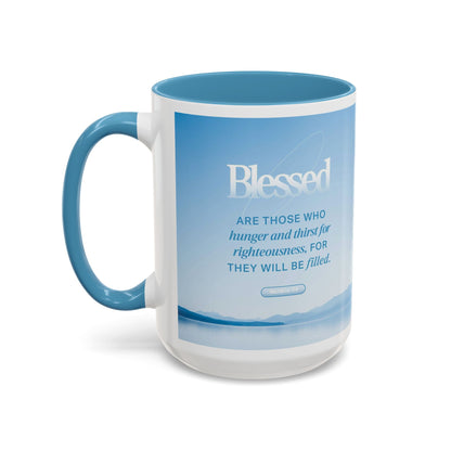 Matthew 5:4 Scripture coffee mug with blue handle featuring the text Blessed on a scenic background