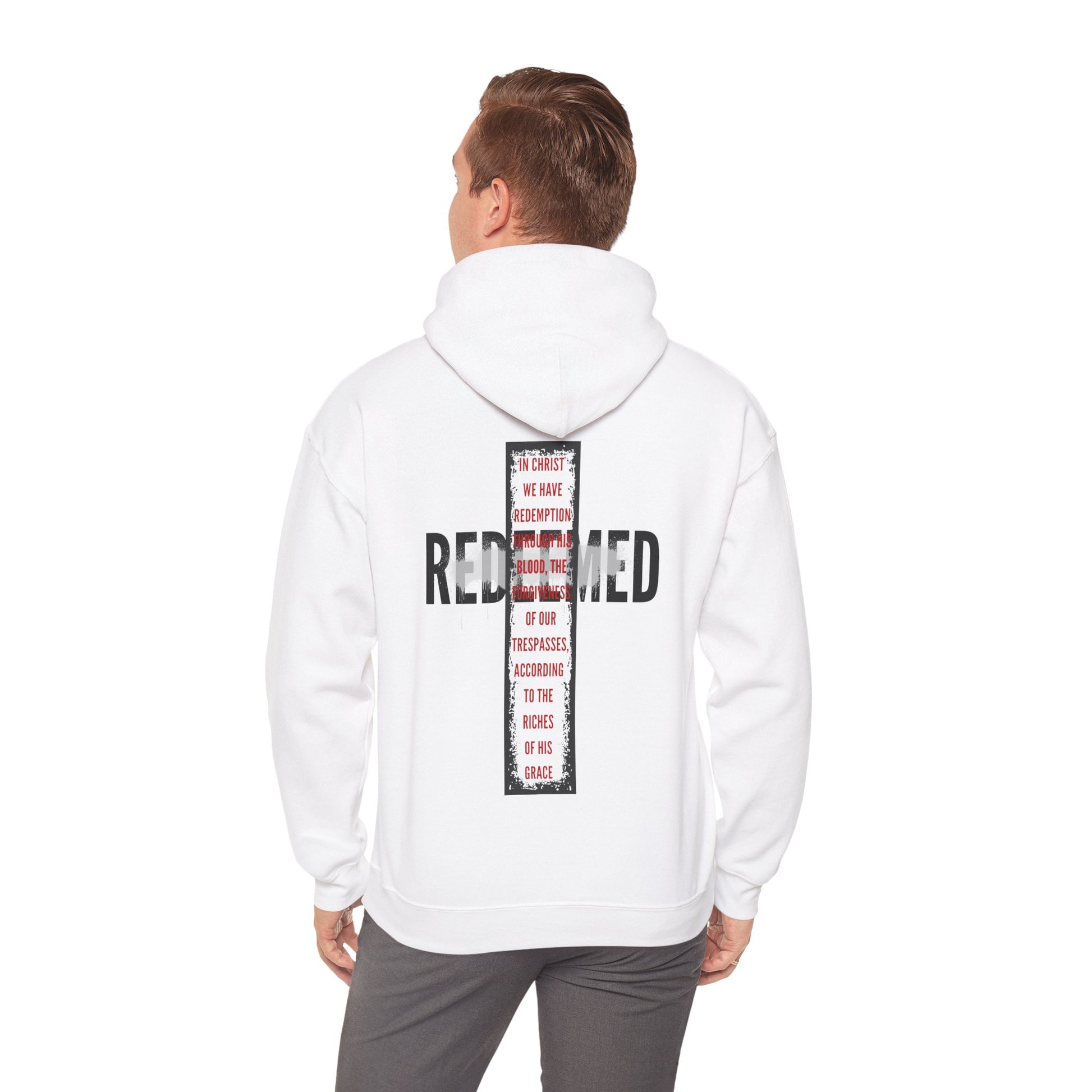 Back view of a white hooded sweatshirt featuring 'Redeemed Ephesians 1:7 sweatshirt' text design for stylish comfort.