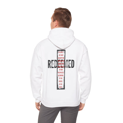 Back view of a white hooded sweatshirt featuring 'Redeemed Ephesians 1:7 sweatshirt' text design for stylish comfort.