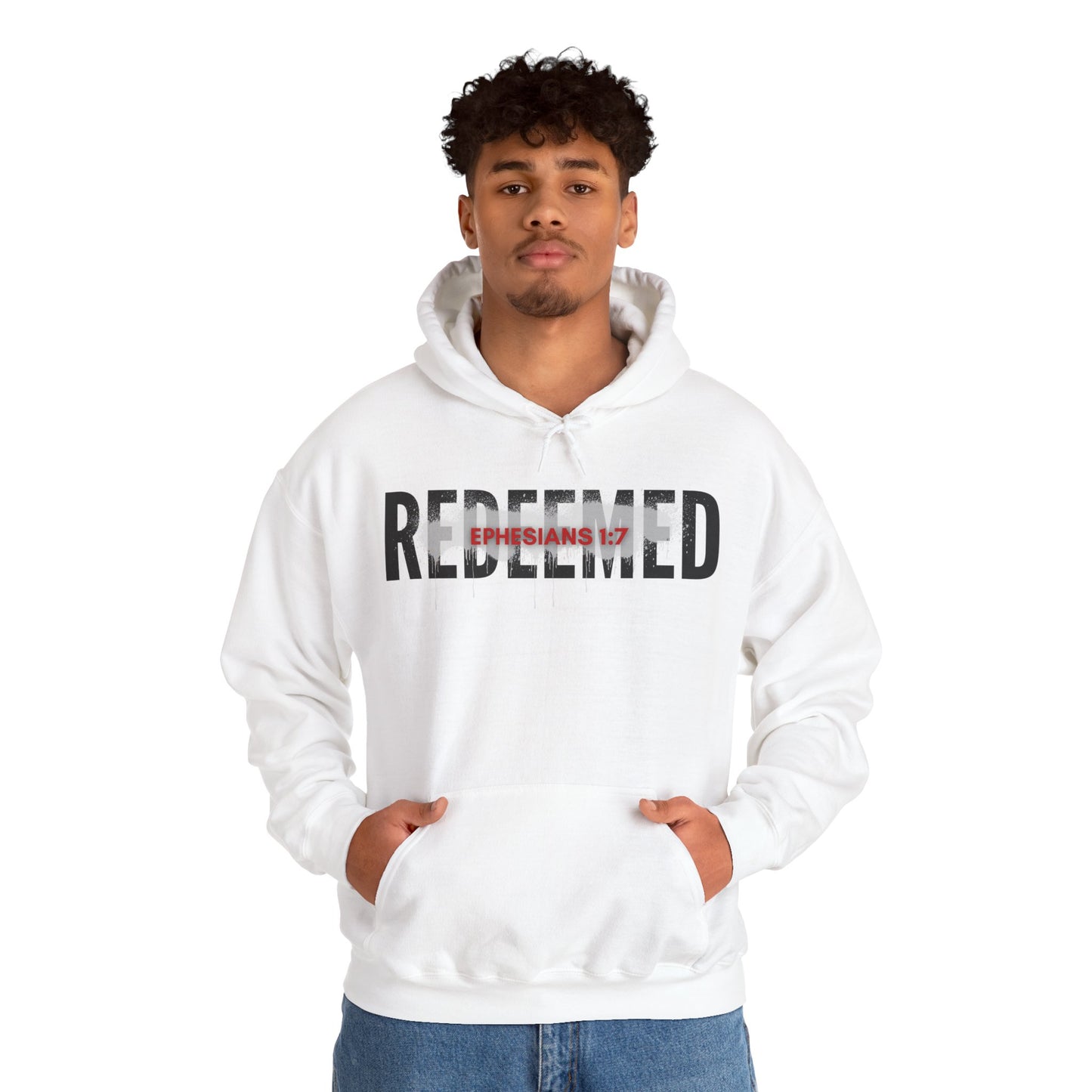 White hooded sweatshirt featuring the text Redeemed Ephesians 1:7 for inspirational fashion