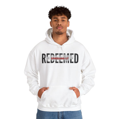 White hooded sweatshirt featuring the text Redeemed Ephesians 1:7 for inspirational fashion
