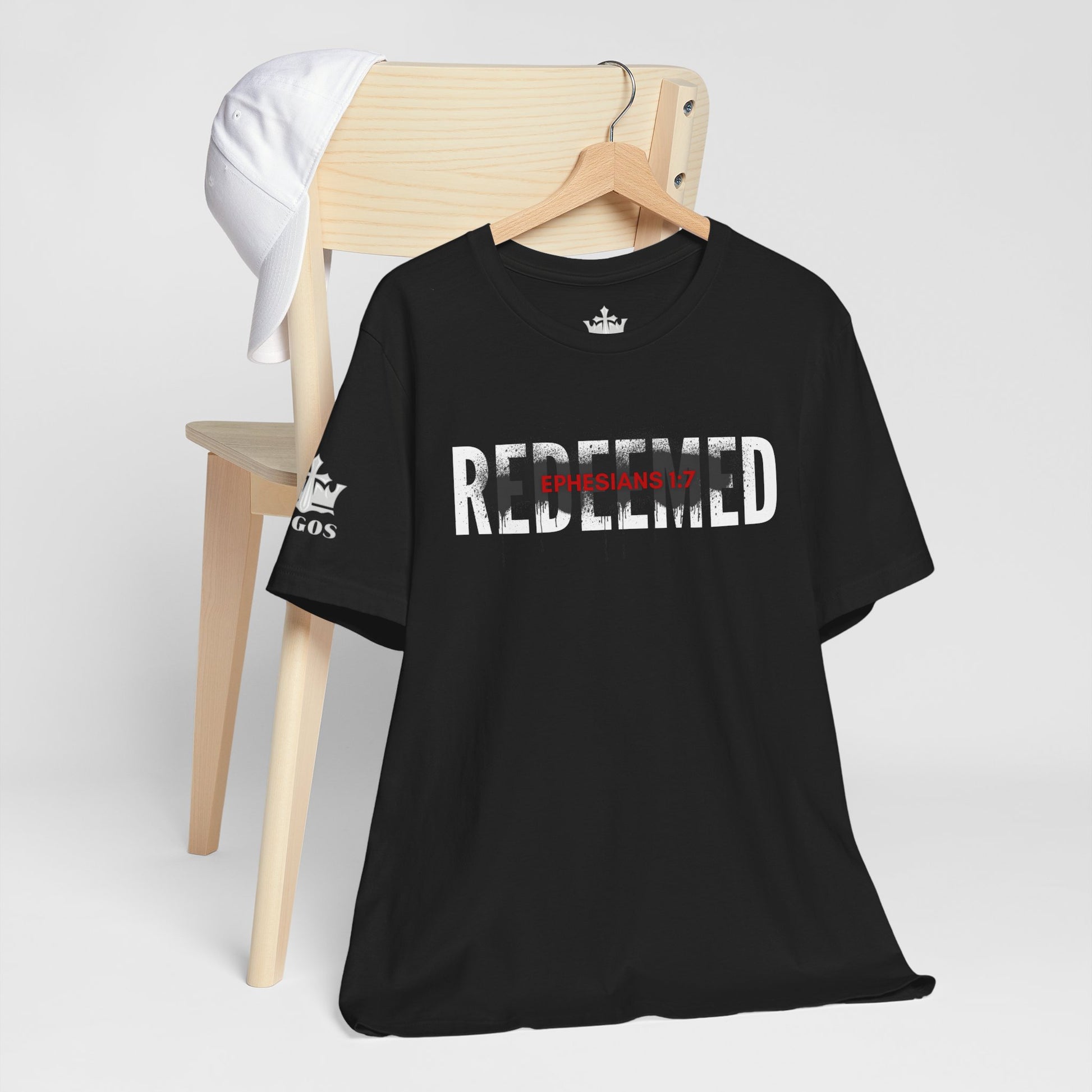 Black Redeemed t-shirt featuring Ephesians 1:7 graphic design on soft fabric