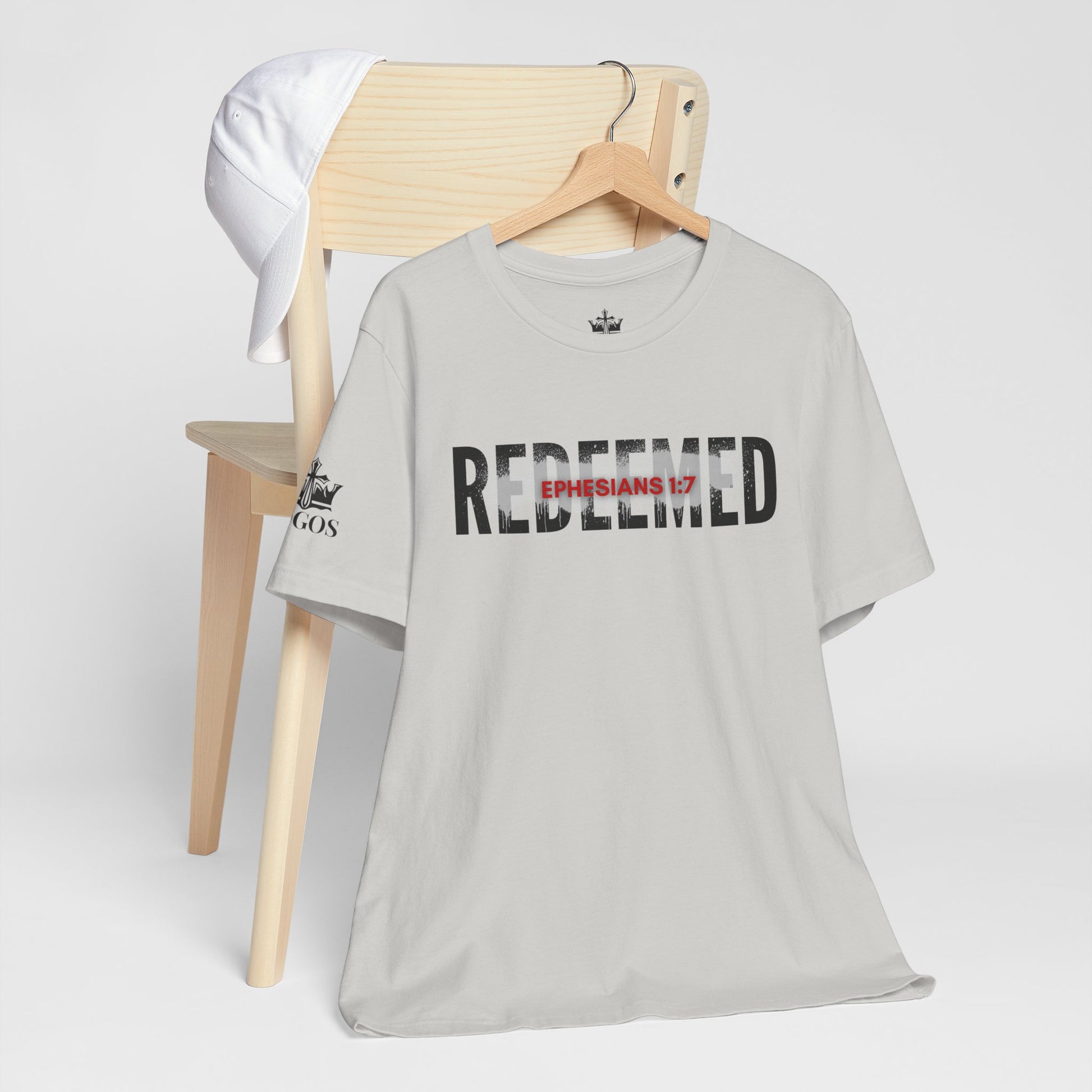 Light gray Redeemed t-shirt featuring Ephesians 1:7 for a stylish faith-inspired look
