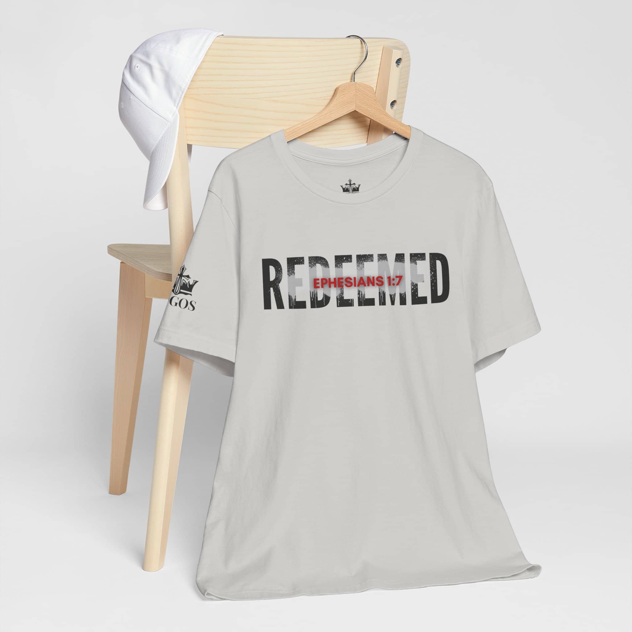 Light gray Redeemed t-shirt featuring Ephesians 1:7 for a stylish faith-inspired look