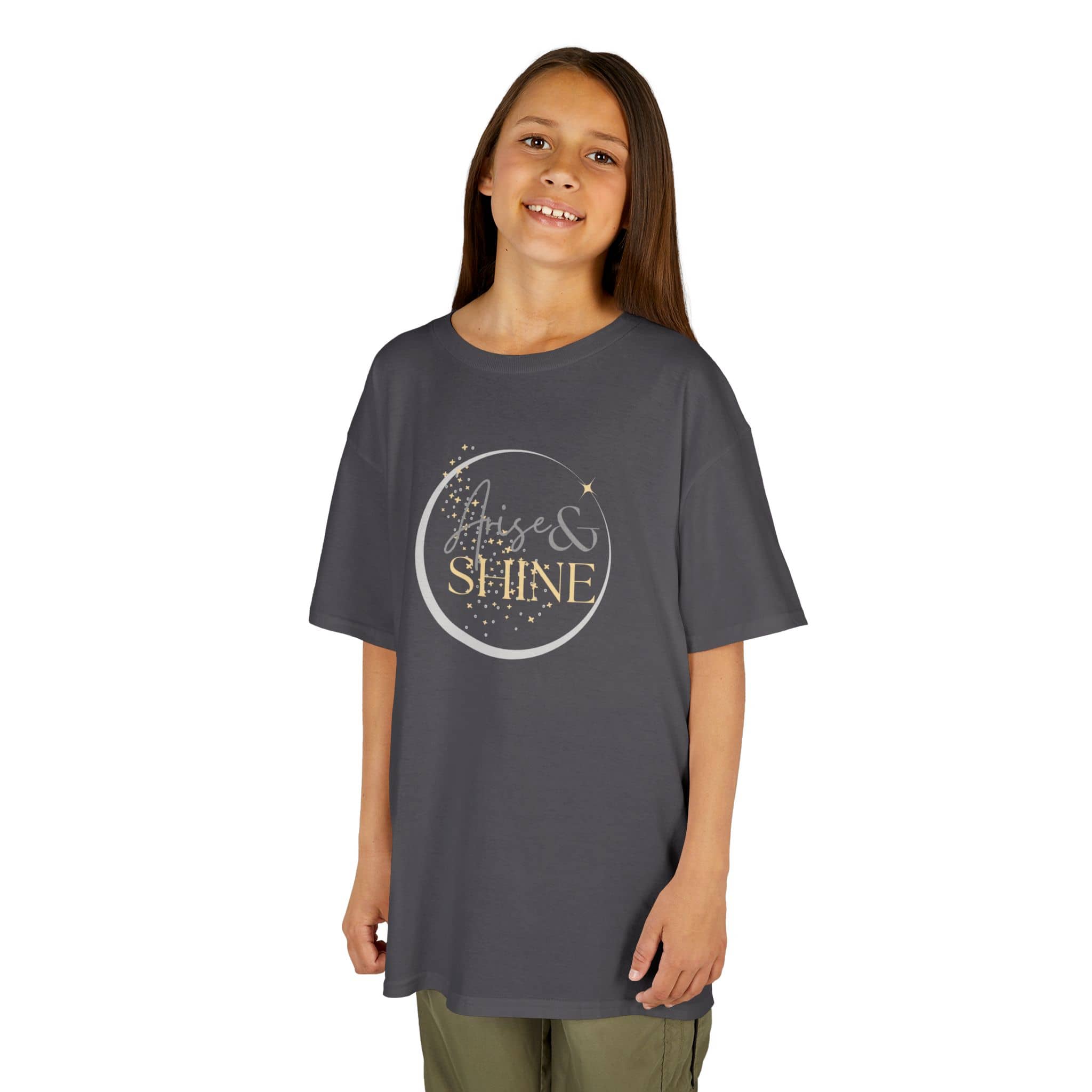 Child wearing a gray Scripture design junior shirt with rise and shine text and stars print