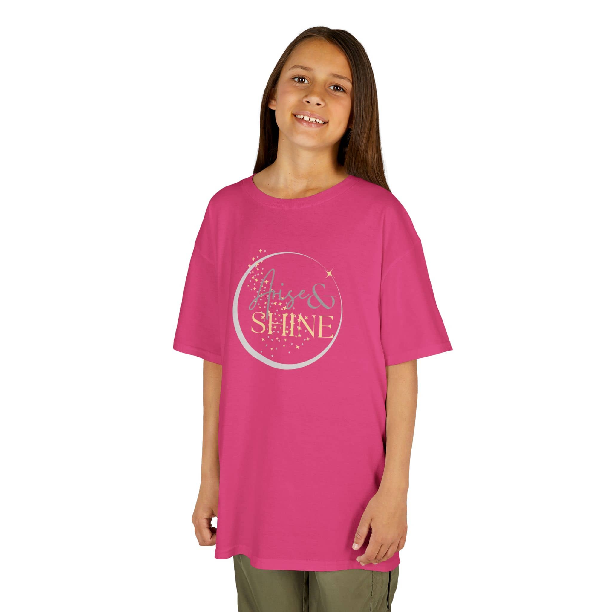 Girl wearing a pink Scripture design junior shirt with Arise and Shine text in gold print