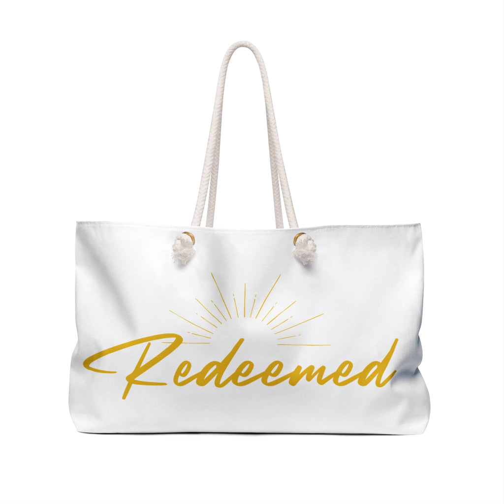 Scripture inspired travel bag with the word Redeemed and sun design for believers on the go