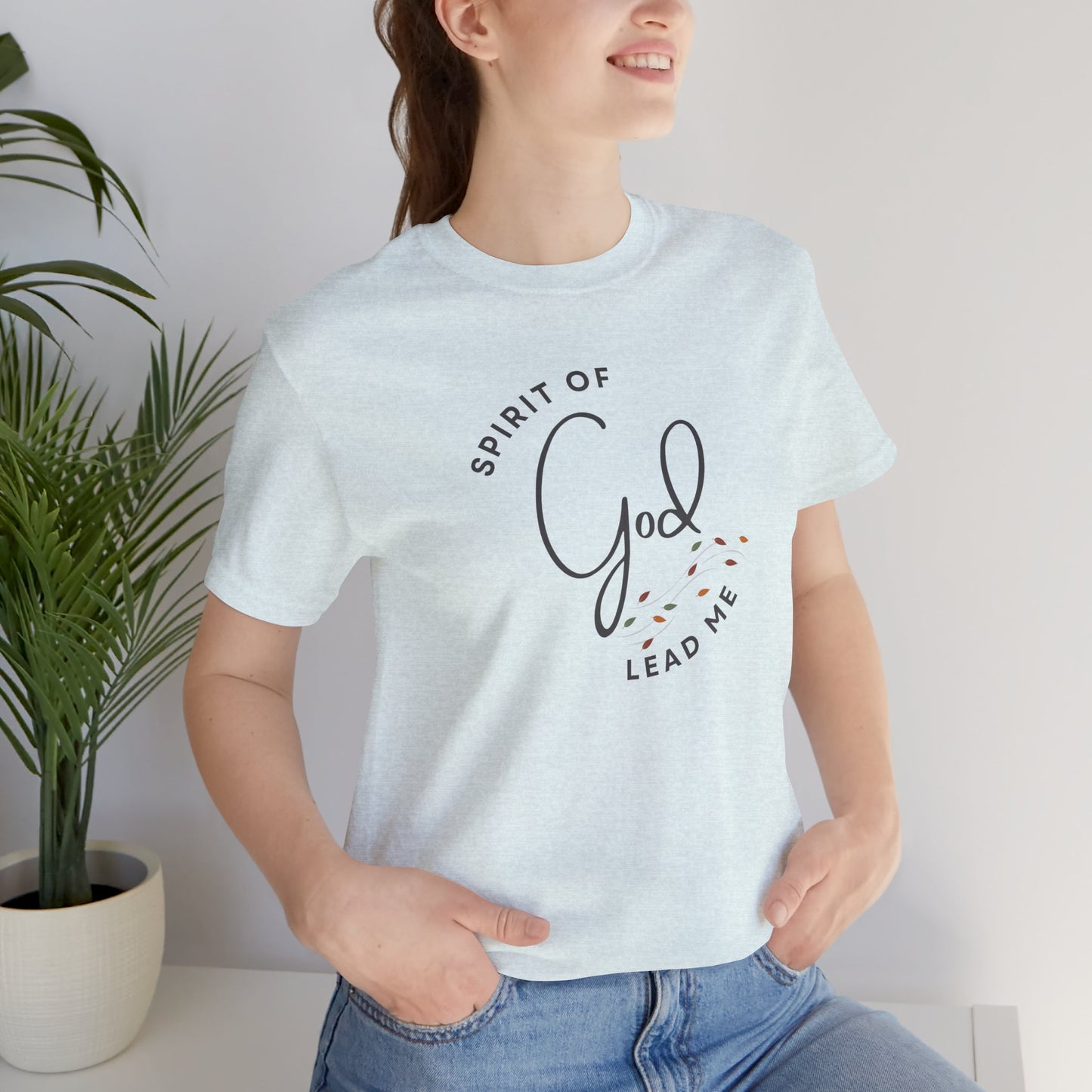Logos Spirit Lead Me shirt in light gray with spiritual text design worn by smiling woman