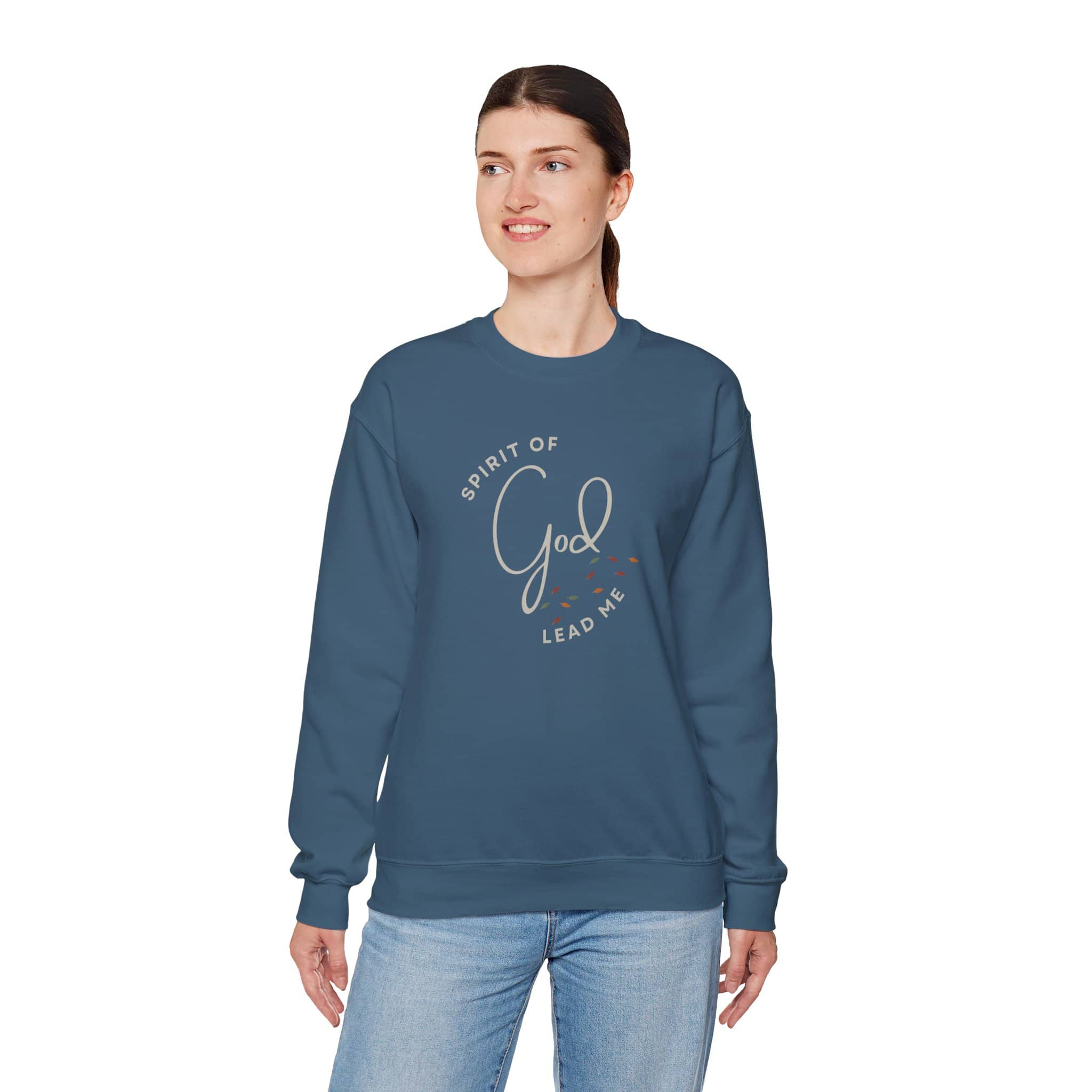 Woman wearing a blue Spirit Lead Me sweatshirt with religious text design from Logos 
