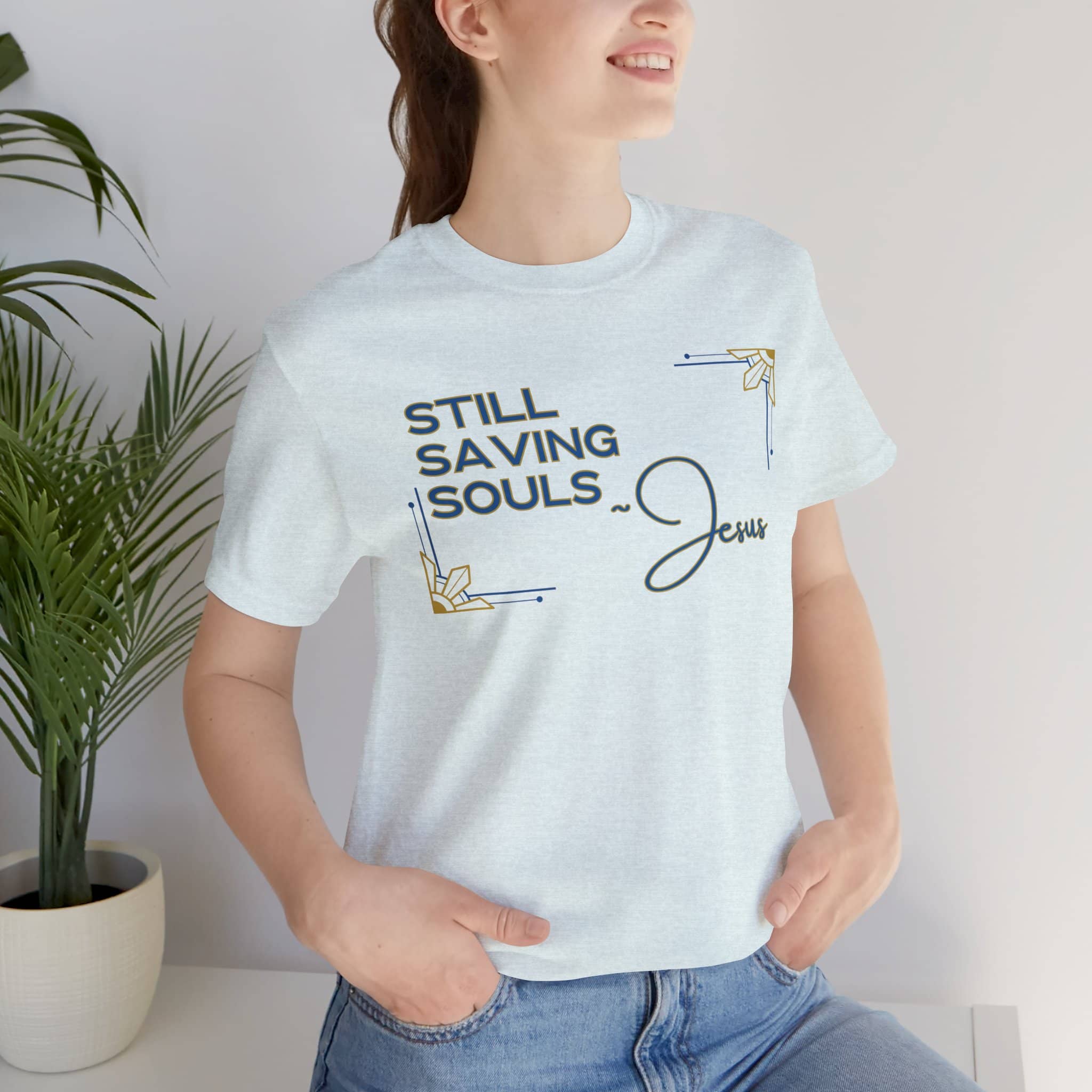 Still Saving Souls shirt worn by woman in light blue with faith-based graphic design