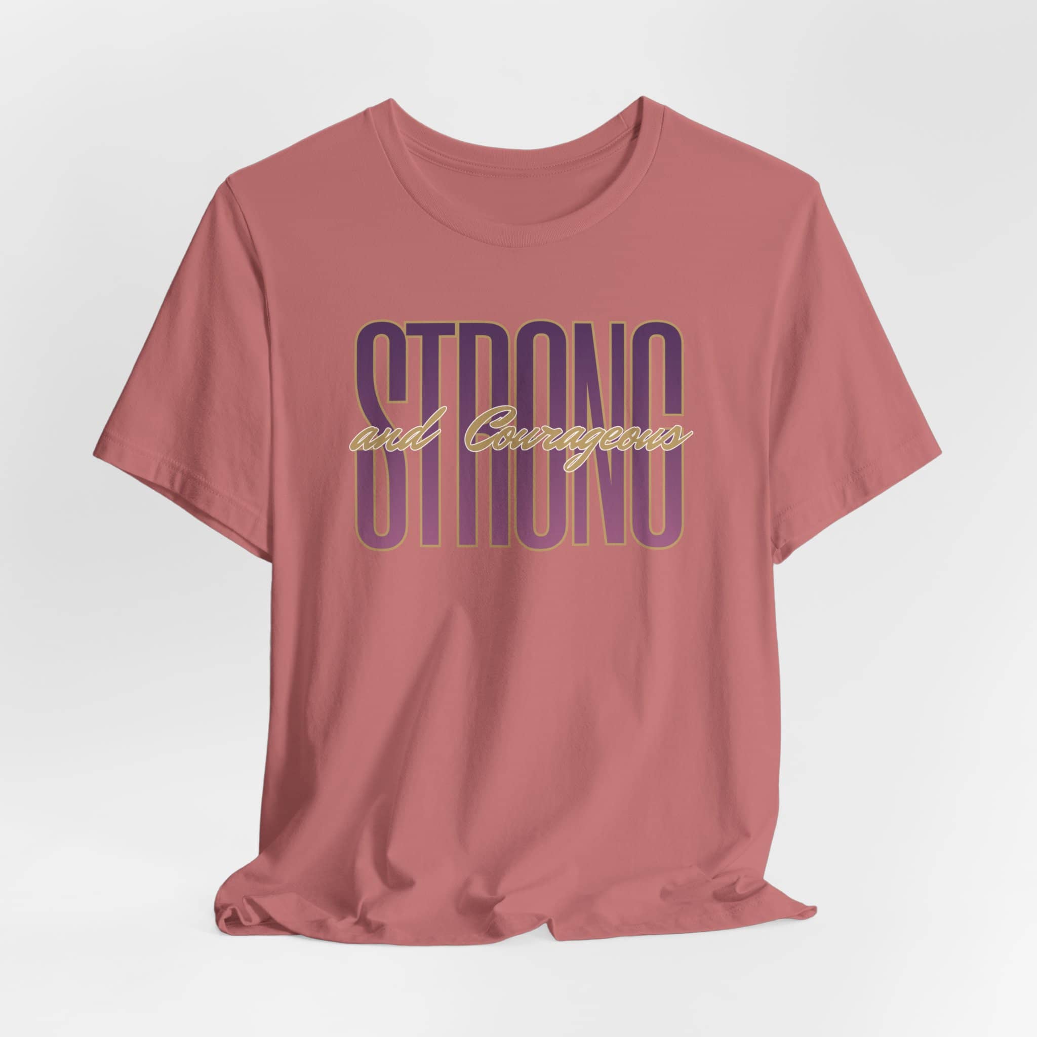 Strong and Courageous Christian t-shirt in dusty rose color with bold lettering design