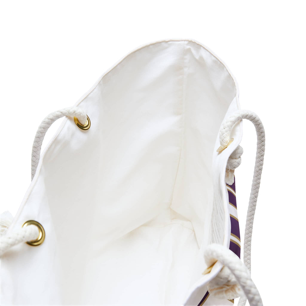 Interior view of a Strong and courageous Scripture bag in white with accenting purple details