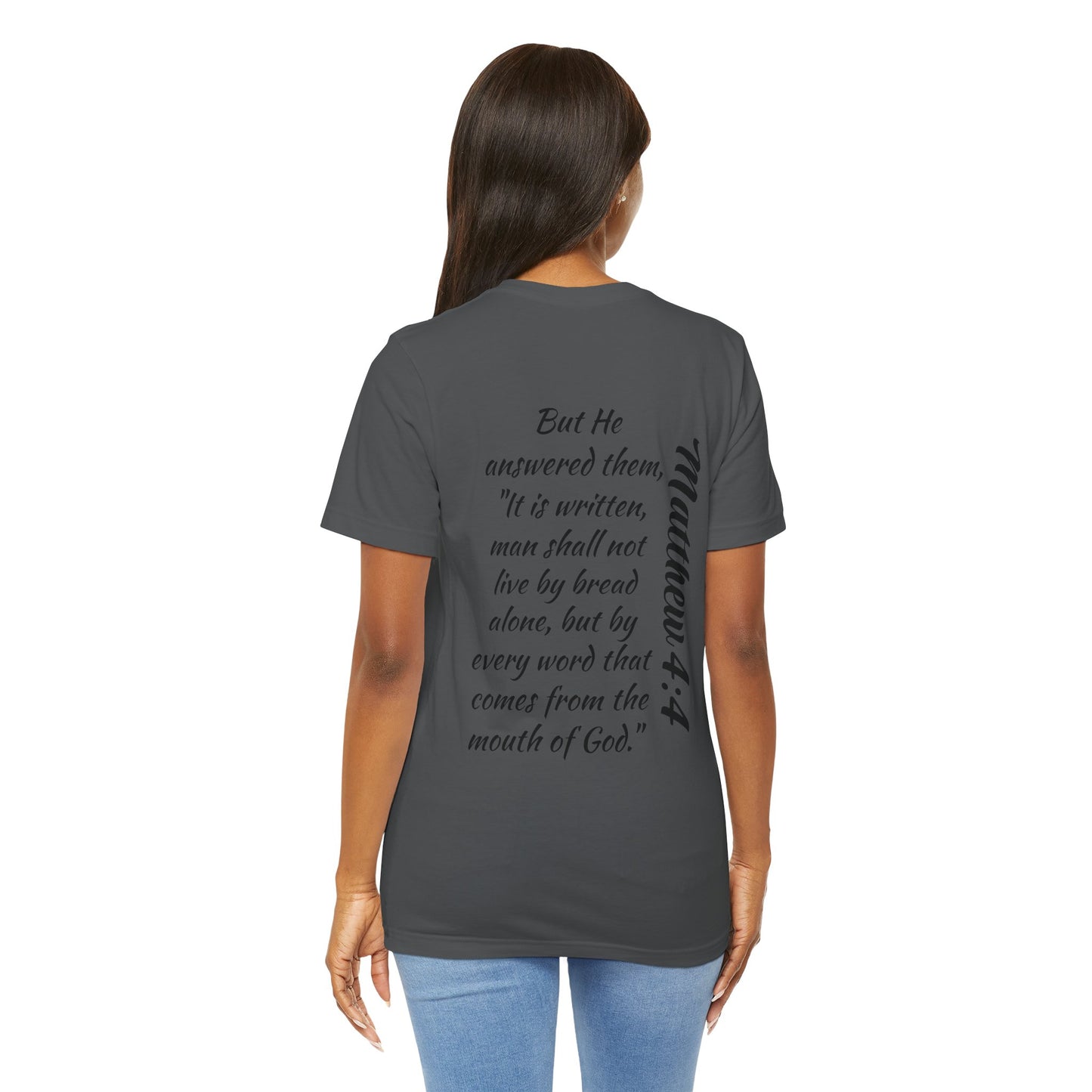 Back view of a woman wearing a Word of Life Christian shirt with a Bible verse print on a dark gray T-shirt