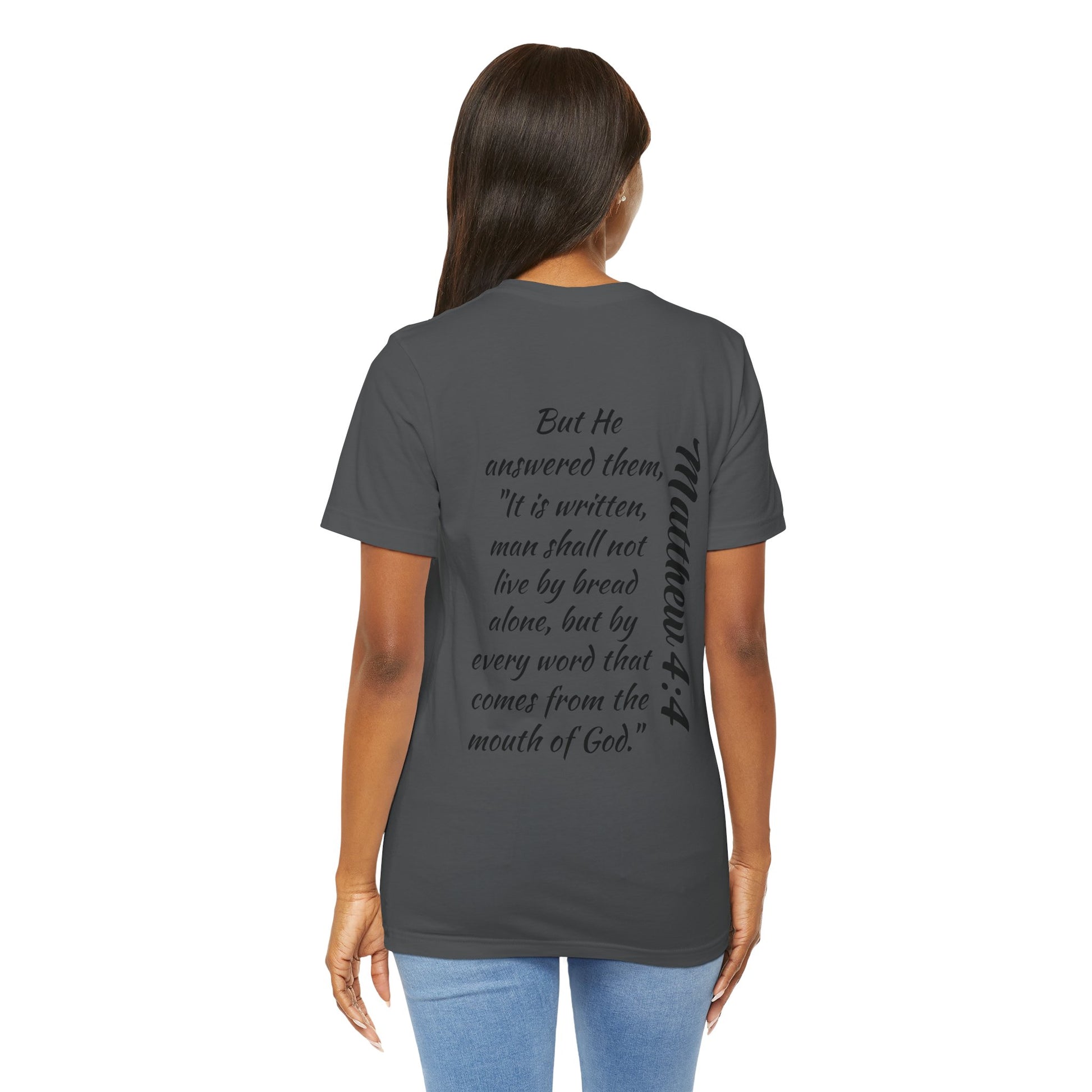 Back view of a woman wearing a Word of Life Christian shirt with a Bible verse print on a dark gray T-shirt